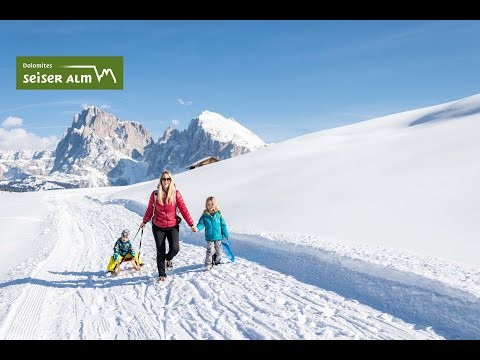 Tobogganing and sledding on the Seiser Alm in the Dolomites